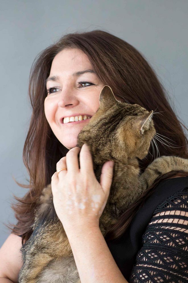 RSPCA CEO Joanna Rowland holding a tabby cat.