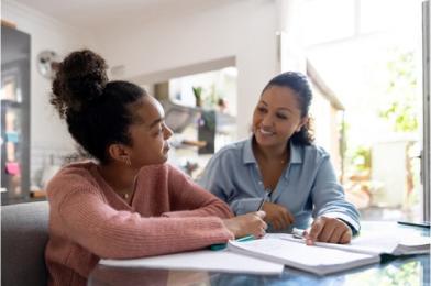 Two people talking over homework