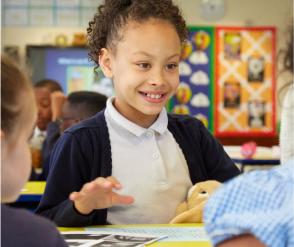 A child in a school, at a desk