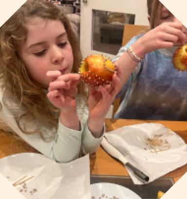 A young girl with a seeded apple