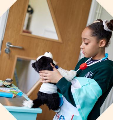 A child with a soft toy dog