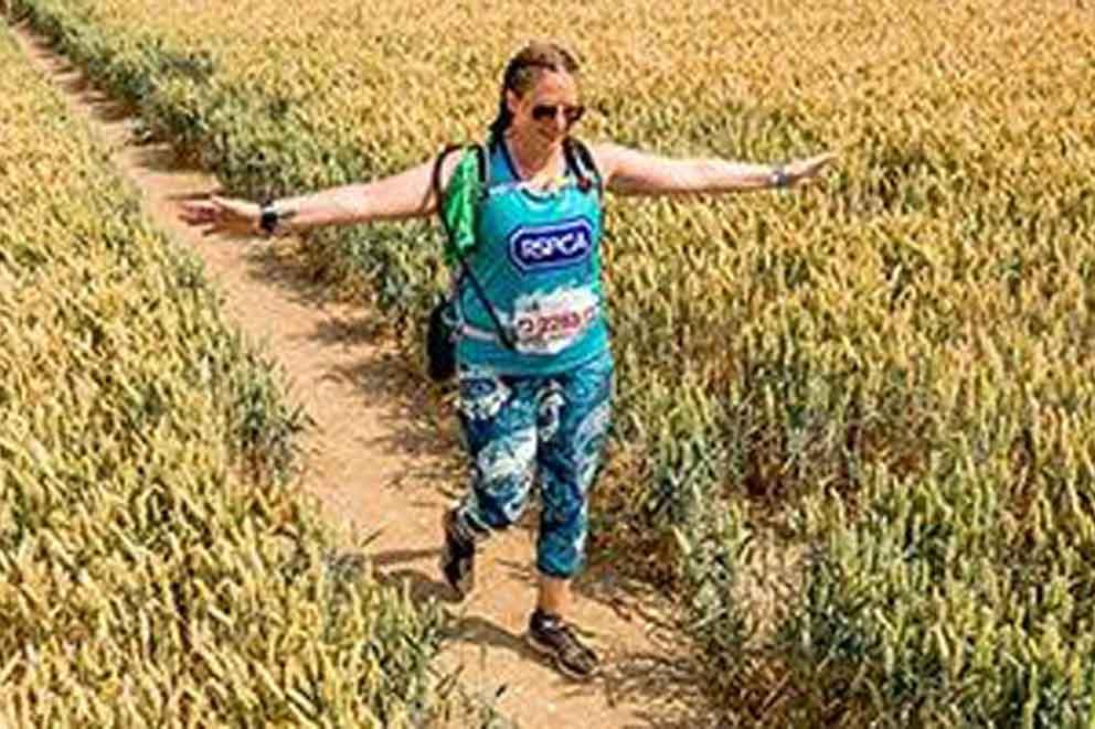 A charity fundraiser walking through a field o