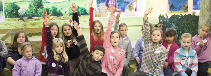 Children with hands up © RSPCA photolibrary