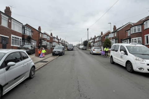 Family inspecting their local community for litter.